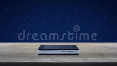 现代智能<strong>手机屏幕</strong>上的免费送货卡车平板图标，放在木制桌子上，覆盖幻想的夜空和月亮，商务活动