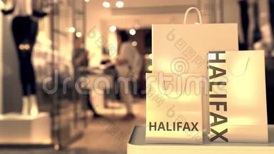 带有哈利法克斯标题的购物袋与模糊的商店入口。 加拿大购物相关概念3D动画