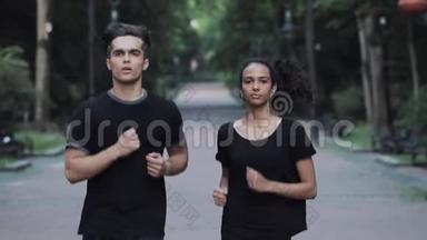 年轻人和女孩在公园里跑步，男人变得疲倦，停止女孩继续跑步的概念，健康的生活方式。