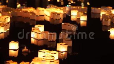 在新年庆祝活动中，漂浮在水面上的中国许愿灯