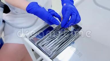 牙医更换钻床头部抛光清洁牙齿，特写双手。