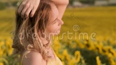 戴着帽子，站在向日葵的田野上，美丽欢快的女孩的特写肖像