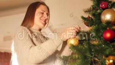 4k特写视频快乐微笑的年轻女子在客厅用装饰圣诞树