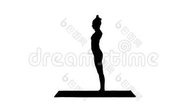 美丽的年轻女子做瑜伽锻炼脚踝，小腿，<strong>大腿</strong>，臀部和肩膀，鹰式鼻子