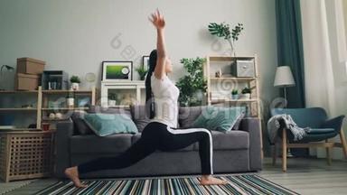 灵活的亚洲女孩在家里做伸展运动，独自练习瑜伽姿势，以改善她的健康和关心