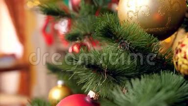 年轻女子在圣诞树树枝上挂金银饰的镜头。
