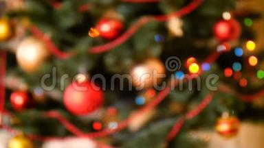 离焦4k抽象<strong>视频</strong>的彩色灯发光和闪烁在<strong>圣诞树</strong>上。 冬天的完美镜头