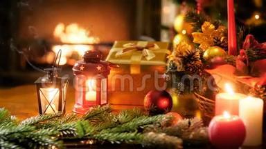 特写4k全景视频，在桌上点燃蜡烛，灯笼，礼物，预告，圣诞花环和五颜六色的