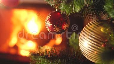 特写4k视频，红色和金色的子挂在圣诞树上，防止房子里的火盆着火