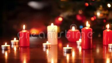 4k多利的视频：在圣诞树上的木桌上点燃了许多红白蜡烛