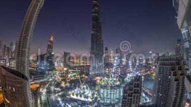 日出前迪拜市区的全景天际线景观，商场、喷泉和摩天大楼日夜高空