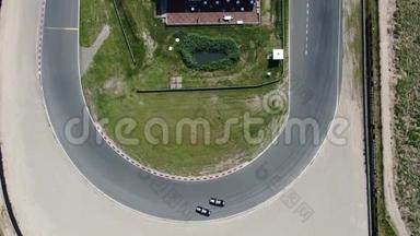 在荷兰的Zandvoort<strong>汽车</strong>运动<strong>赛道</strong>上，从转角处飘过4k视频空中视频