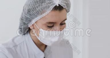 特写镜头中的女医生在面具谁做注射程序。医生肖像