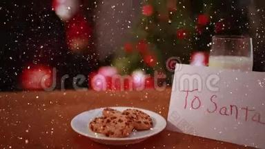带有饼干和<strong>圣诞树</strong>的书桌上降雪的<strong>视频</strong>构图