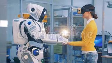 增强现实概念。 机器人把手放在女人`手上。
