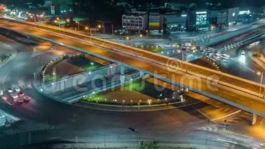 泰国曼谷夜间4路停车街交叉路口环形交叉路口夜间城市交通时间的推移。 4KUHD水平