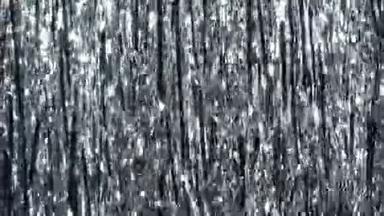 银丝雨。闪光和闪烁粒子中的动态背景