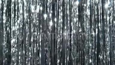 银丝雨。闪光和闪烁粒子中的动态背景