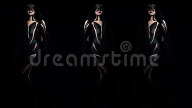 蒙太奇一个戴面具的女孩的复制品和黑色的<strong>身体艺术</strong>，上面覆盖着一条黑色背景的披肩