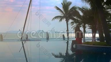 泳池边的妇女剪影剪影与海滨的餐桌