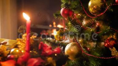 特写4k<strong>视频</strong>，在装饰<strong>圣诞树</strong>，蜡烛和燃烧的壁炉上发光。 完美的背景