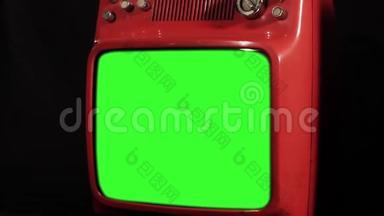 旧的70年代红色电视与绿色屏幕。 放大。