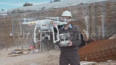 建筑工程师利用无人机在建筑工地进行空中摄影