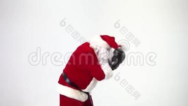 圣诞节。 白色背景上的圣诞老人戴着黑色<strong>拳击</strong>手套，完成了<strong>拳击</strong>。 <strong>拳击</strong>，<strong>拳击</strong>手。