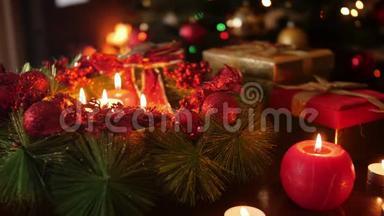 用燃烧的蜡烛制作圣诞花环的特写视频.. 完美的背景或背景圣诞或新年