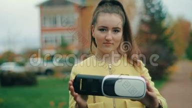 布鲁内特年轻女子黄色测试虚拟现实耳机