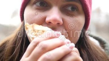 一个眼睛饿的女孩很高兴地吃沙瓦玛，<strong>蔬菜</strong>从她嘴里伸出来。 高清，1920x1080，慢动作