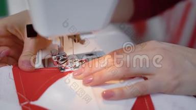 女人的手在缝纫机上`特写镜头。