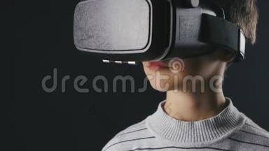 特写男孩10岁使用虚拟现实头盔。 儿童使用VR360的经验