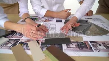 在办公室里，三个工人正在讨论<strong>建筑</strong>图纸. 近距离拍摄手臂移<strong>动图</strong>片