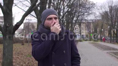一个男人在街上咳嗽，慢镜头射击