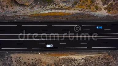 在西班牙加那利群岛特内里费高速公路上行驶的卡车和其他交通的鸟瞰图。 加速视频