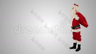 圣诞老人摇着一个有文字空间的钟，对着白色的股票镜头