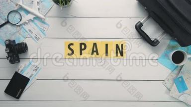 顶部视图时间流逝手铺设白色书桌字`西班牙`装饰旅游项目