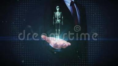 商人打开手掌，旋转人体骨骼结构，骨系统，蓝色X光..