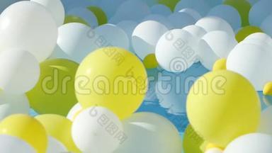 漂浮在水面上的黄色和白色气球