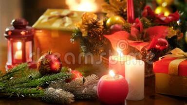 特写4k圣诞花环和燃烧蜡烛的视频.. 冬季庆典和假日的完美背景