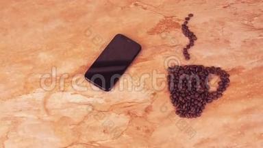 一杯咖啡豆和一部手机。 在厨房大理石桌上，有一杯咖啡豆和手机的标志。