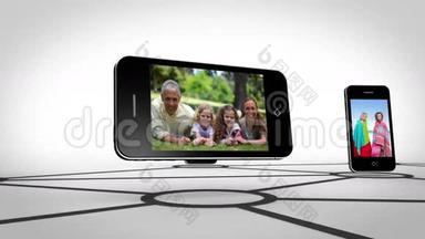 <strong>家庭</strong>在智能手机屏幕上快乐在一起