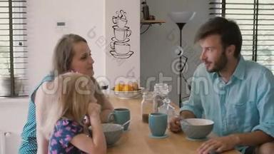 年轻的父亲在早餐时看着他的妻子和女儿在厨房的桌子上。 慢动作，斯蒂达康射中