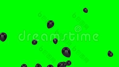 漂浮在绿色上的黑色气球