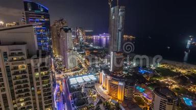 阿联酋<strong>迪拜</strong>Jumeirah海滩JBR酒店的现代摩天大楼和海滩的鸟瞰<strong>夜景</strong>