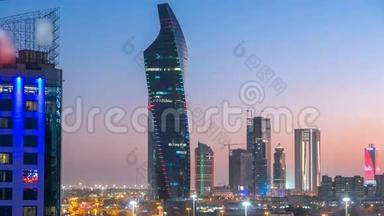 在科威特城市中心，摩天大楼的天际线在黄昏时分被照亮。 中东科威特市