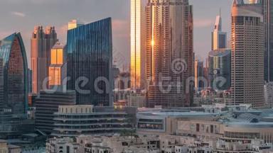 航空日落城市景观与迪拜市区建筑时间推移，阿拉伯联合酋长国。