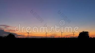日落大气中发电、生态、清洁发电风力发电机组剪影风景