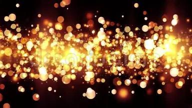 背景有闪亮的金色粒子。 漂亮的bokeh光背景。 金色的五彩纸屑与神奇的闪光